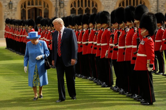US President Donald Trump and Queen Elizabeth II inspect a Guard of Honour, formed of the Coldstream Guards, at Windsor Castle, Windsor. PRESS ASSOCIATION Photo. Picture date: Friday July 13, 2018. See PA story POLITICS Trump. Photo credit should read: Matt Dunham/PA Wire