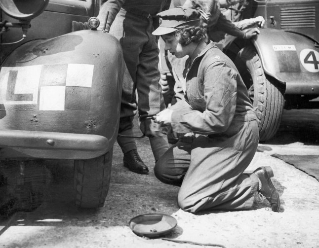 Princess Elizabeth learning basic car maintenance as a Second Subaltern in the A.T.S 12th April 1945. (Photo by Daily Mirror/Mirrorpix/Mirrorpix via Getty Images)