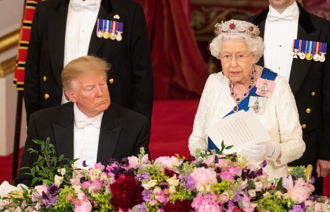 US President Donald Trump listens as Queen Elizabeth II makes a speech during the State Banquet at Buckingham Palace, London, on day one of President Trump's three day state visit to the UK. PRESS ASSOCIATION Photo. Picture date: Monday June 3, 2019. See PA story ROYAL Trump. Photo credit should read: Dominic Lipinski/PA Wire