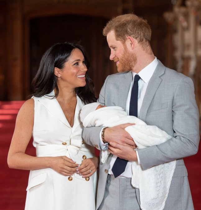 WINDSOR, ENGLAND - MAY 08: Prince Harry, Duke of Sussex and Meghan, Duchess of Sussex, pose with their newborn son Archie Harrison Mountbatten-Windsor during a photocall in St George's Hall at Windsor Castle on May 8, 2019 in Windsor, England. The Duchess of Sussex gave birth at 05:26 on Monday 06 May, 2019. (Photo by Dominic Lipinski - WPA Pool/Getty Images)
