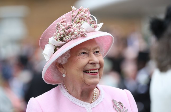 Queen Elizabeth II meets guests as she attends the Royal Garden Party.