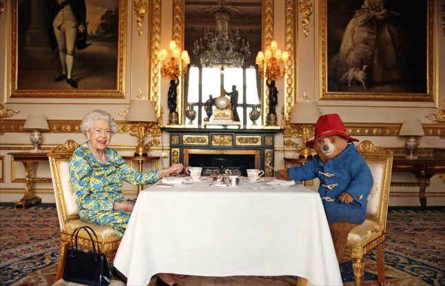 Undated handout photo of Queen Elizabeth II and Paddington Bear having cream tea at Buckingham Palace taken from a film that was shown at the BBC Platinum Party at the Palace. Issue date: Saturday June 4, 2022. PA Photo. See PA story ROYAL Jubilee Paddington. Photo credit should read: Buckingham Palace/ Studio Canal / BBC Studios / Heyday Films/PA Wire EDITORIAL USE ONLY. The copyright for the photograph vests with Buckingham Palace/ Studio Canal / BBC Studios. Publications are asked to credit Buckingham Palace/ Studio Canal / BBC Studios / Heyday FilmsThe photograph shall not be used without permission from Royal Communications. There shall be no commercial use whatsoever of the photograph (including any use in merchandising, advertising or any other non-editorial use). The photograph must not be digitally enhanced, manipulated or modified in any manner or form when published. The photograph will be free for press usage until 30th June 2022. It must not be used after this date without prior, written permission from Royal Communications, and no further licensing can be made. NOTE TO EDITORS: This handout photo may only be used in for editorial reporting purposes for the contemporaneous illustration of events, things or the people in the image or facts mentioned in the caption. Reuse of the picture may require further permission from the copyright holder.
