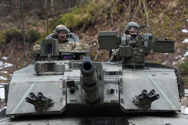 Britain's Prince William, Prince of Wales rides in a Challenger 2 tank as he visits the Mercian Regiment training area at Tapa Army Base, Estonia, March 21, 2025. REUTERS/Suzanne Plunkett