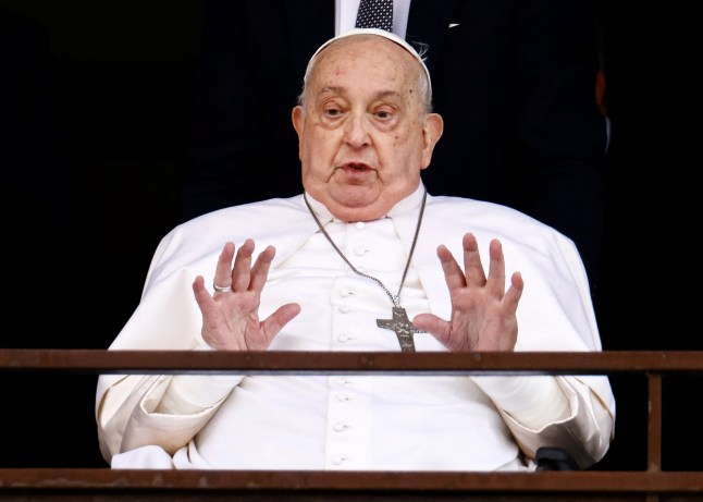 Pope Francis gestures during his first public appearance in five weeks, on the day he is set to be discharged from Gemelli Hospital, in Rome, Italy, March 23, 2025. REUTERS/Yara Nardi TPX IMAGES OF THE DAY