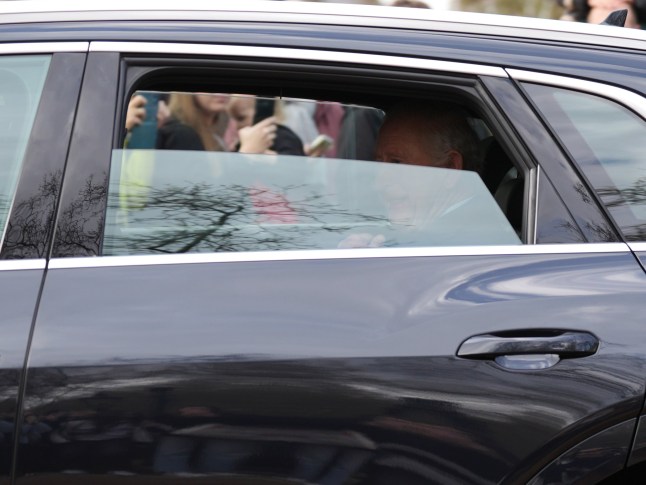 King Charles III is driven by car from Clarence House, his London home, along The Mall towards Buckingham Palace. The King has been seen in public for the first time since a hospital visit for side effects from his cancer treatment as he waved at well-wishers while leaving Clarence House in London this morning. Picture date: Friday March 28, 2025. PA Photo. See PA story ROYAL King. Photo credit should read: Ben Whitley/PA Wire