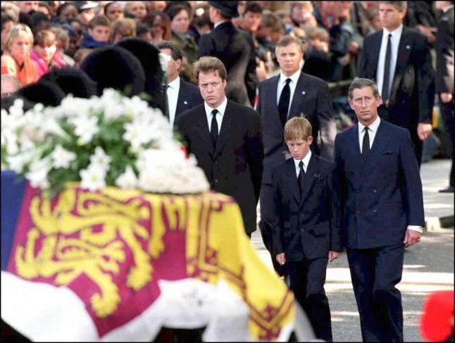 The coffin of Diana, Princess of Wales makes its way to Westminster Abbey surrounded by the bearer party of Welsh Guardsmen, 06 September, followed by (l/r) the Earl Spencer, Prince Harry and The Prince of Wales. (Photo by ADAM BUTLER / PA POOL / AFP) (Photo by ADAM BUTLER/PA POOL/AFP via Getty Images)